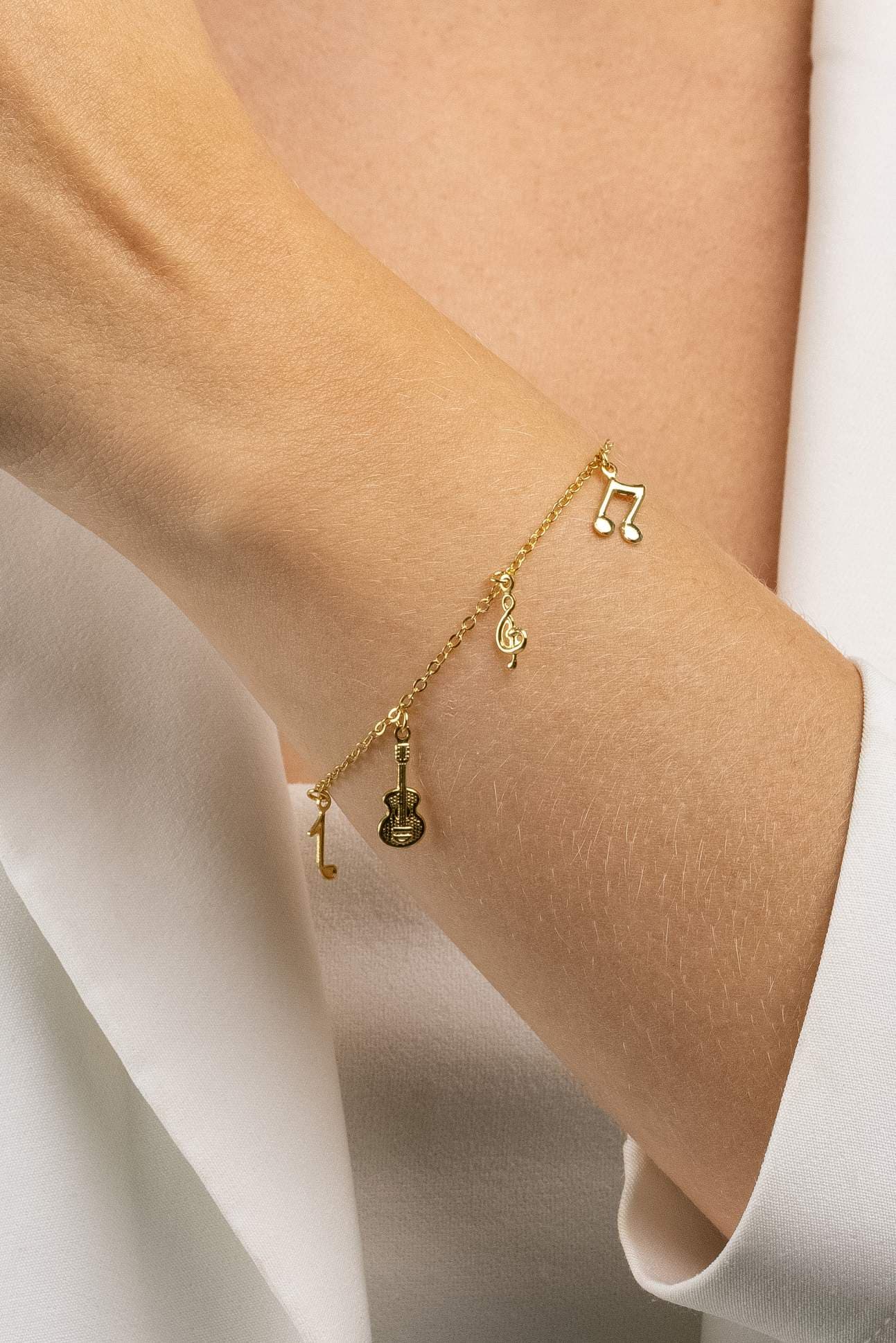 PULSEIRA ELO CADEADO SIMBOLOS DE MUSICA 18CM UDINE — foto 1